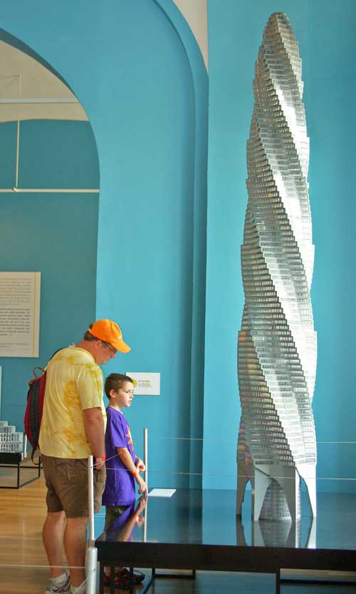 Visitors to the National Building Museum’s exhibition LEGO® Architecture: Towering Ambition look at Adam Reed Tucker’s model of the unbuilt Chicago Spire designed by Santiago Calatrava.