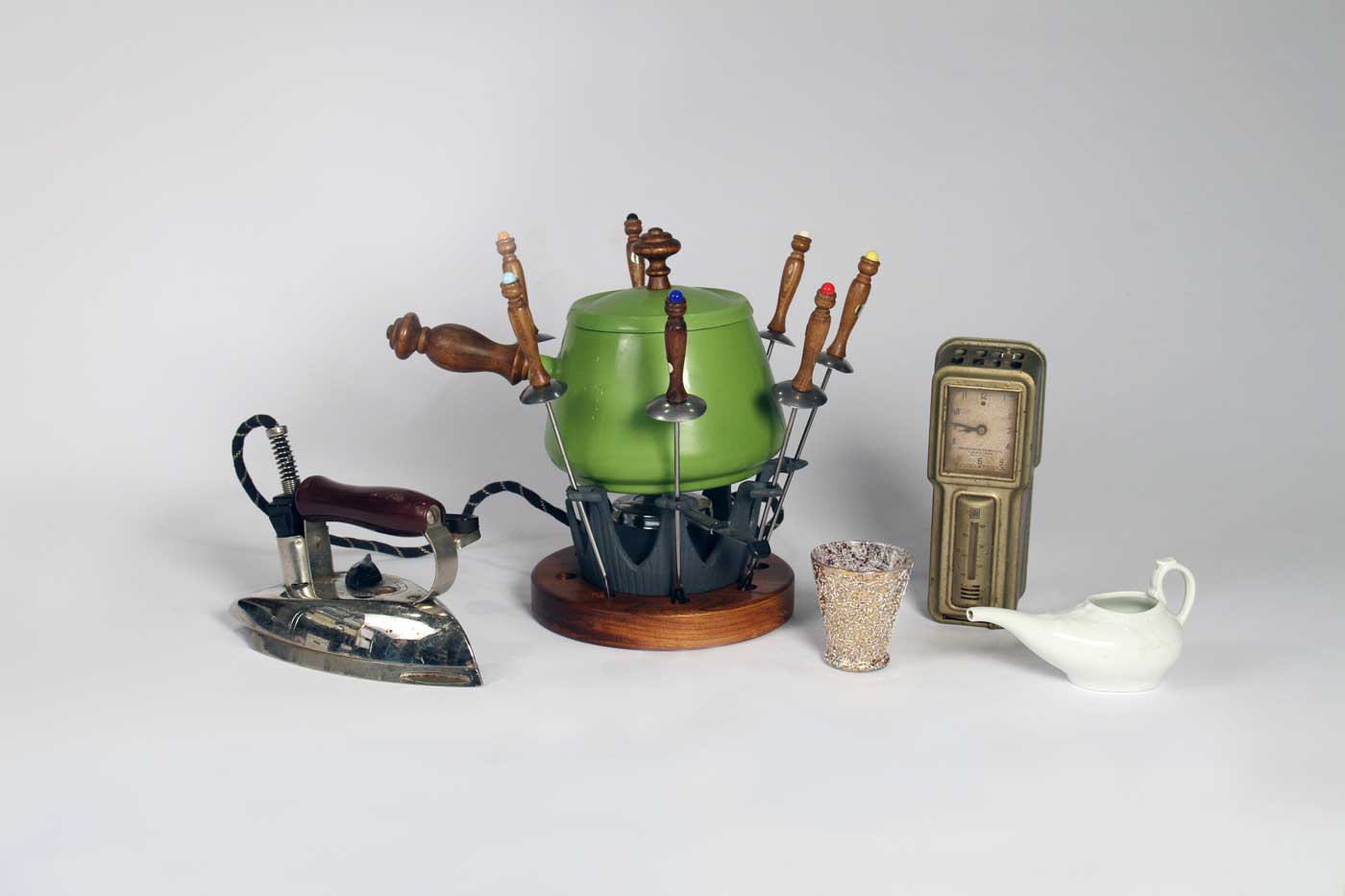 Iron, 1930s; Fondue set, 1970s; Cocktail glass, 1950s; Thermostat, 1920s; Pap feeder, 1880s. Photo by Museum staff.
