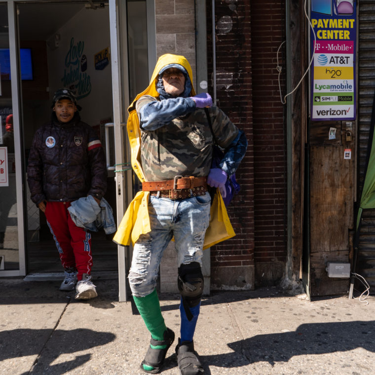 March 26, 2020: Carlos, 68 years old, originally from the Dominican Republic, waiting for the bus on Third Avenue at East 149th Street, Bronx, New York. © Camilo José Vergara 