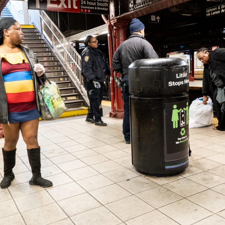 March 22, 2020: Police officers speaking to a disruptive woman (far right) at the 96th Street subway station, New York, New York. © Camilo José Vergara 