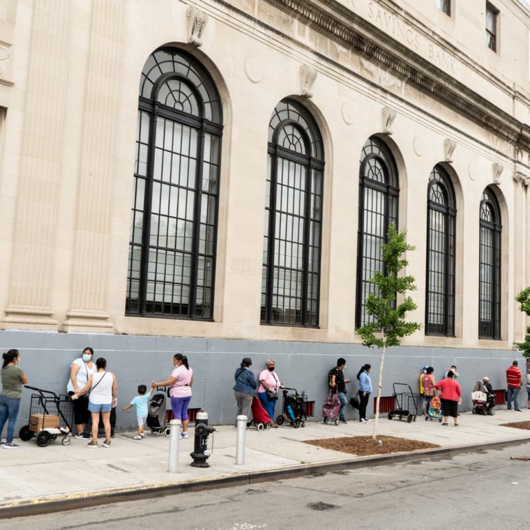 June 5, 2020: View of the line waiting to pick up free food from the Community Services Food Program, East 147th Street toward Willis Avenue, Bronx, New York. © Camilo José Vergara 