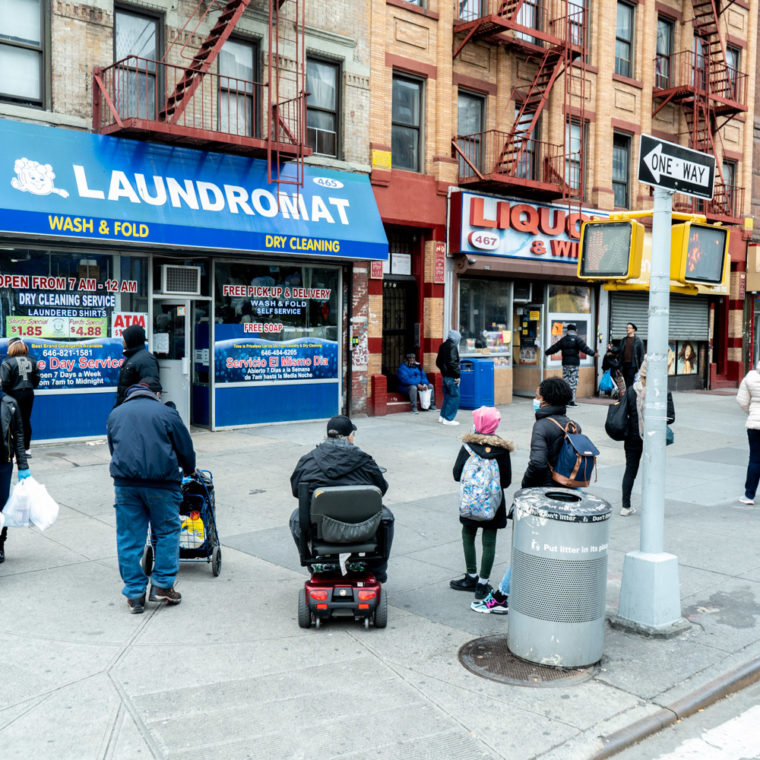 April 17, 2020: Waiting outside a laundromat at the corner of West 133rd Street and Malcolm X Boulevard, Harlem, New York, New York. © Camilo José Vergara 