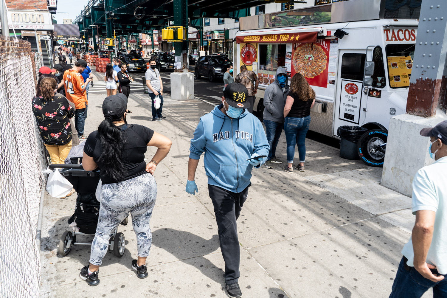 May 17, 2020: Waiting to order tacos from the famous Birria-Landia food truck at 78th Street and Roosevelt Avenue, Queens, New York. © Camilo José Vergara