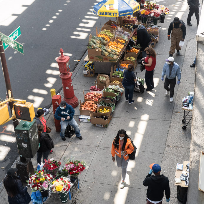 May 7, 2020: Street vendors selling fruits, flowers, masks, gloves, and alcohol, Broadway at Flushing Avenue, Brooklyn, New York. © Camilo José Vergara 