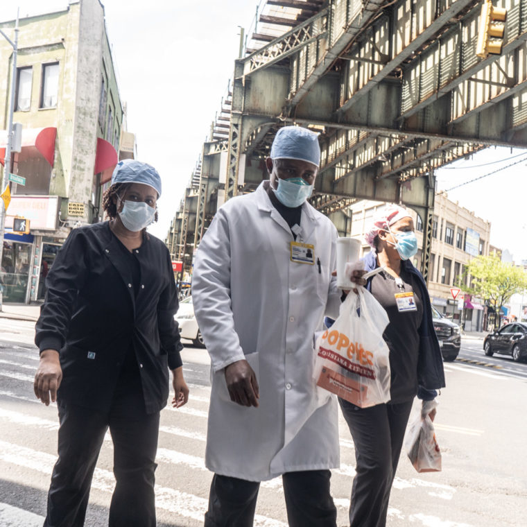 May 16, 2020: Woodhull Medical Center staffers heading back to work at Flushing Avenue and Broadway in Brooklyn, New York. © Camilo José Vergara 