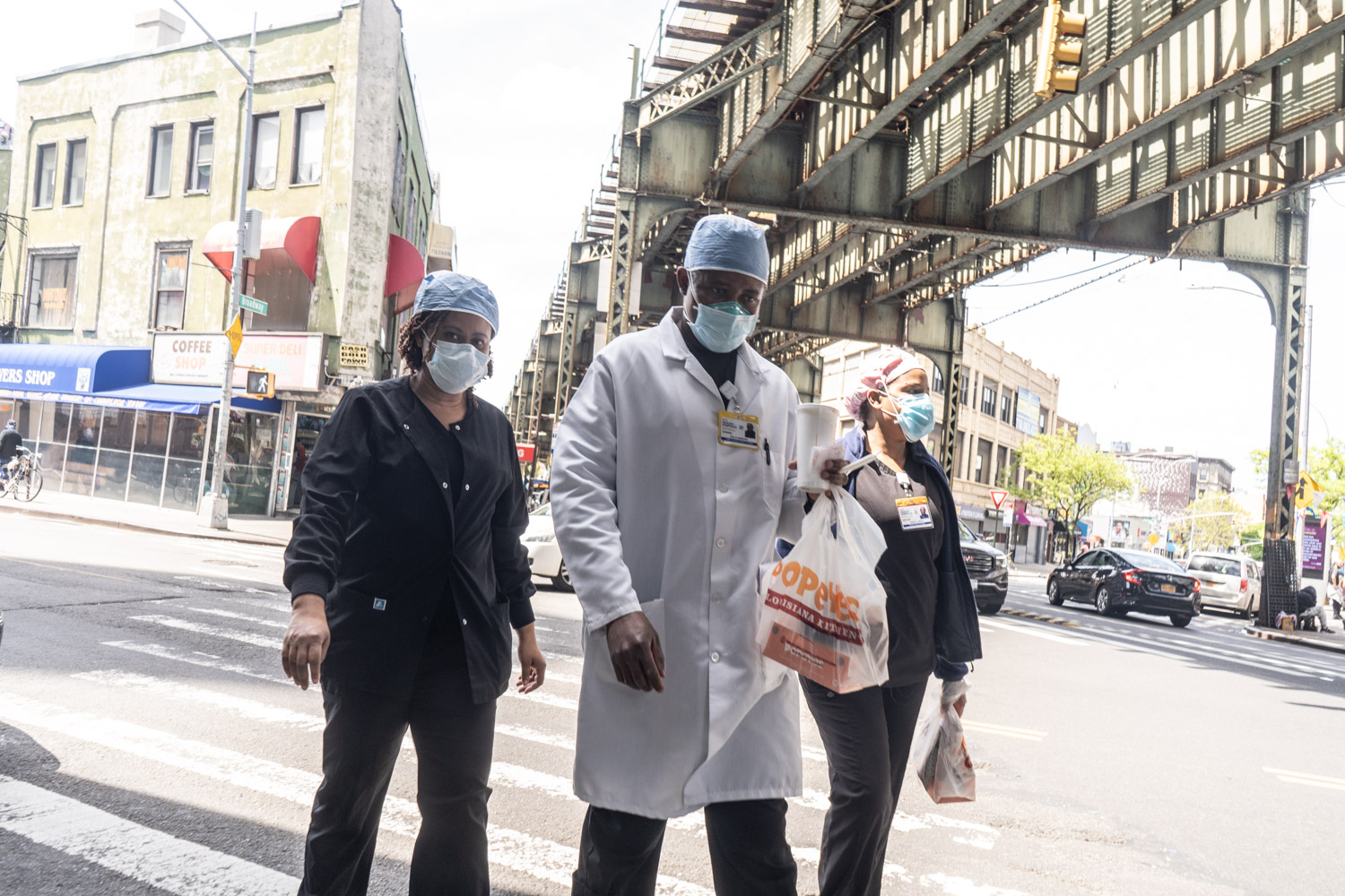 May 16, 2020: Woodhull Medical Center staffers heading back to work at Flushing Avenue and Broadway in Brooklyn, New York. © Camilo José Vergara