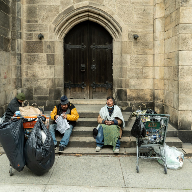 April 17, 2020: Three homeless men in their usual spot, a side entrance to the Cathedral of Saint John the Divine, West 110th Street at Amsterdam Avenue, New York, New York. © Camilo José Vergara 