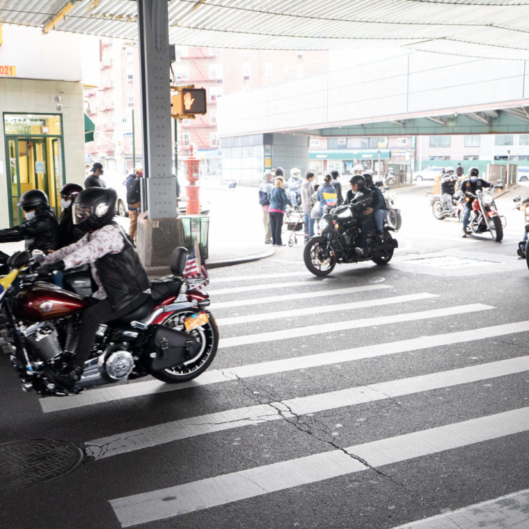 May 24, 2020: Bikers displaying the Colombian and the American flag, Roosevelt Avenue at 75th Street, Queens, New York. © Camilo José Vergara 
