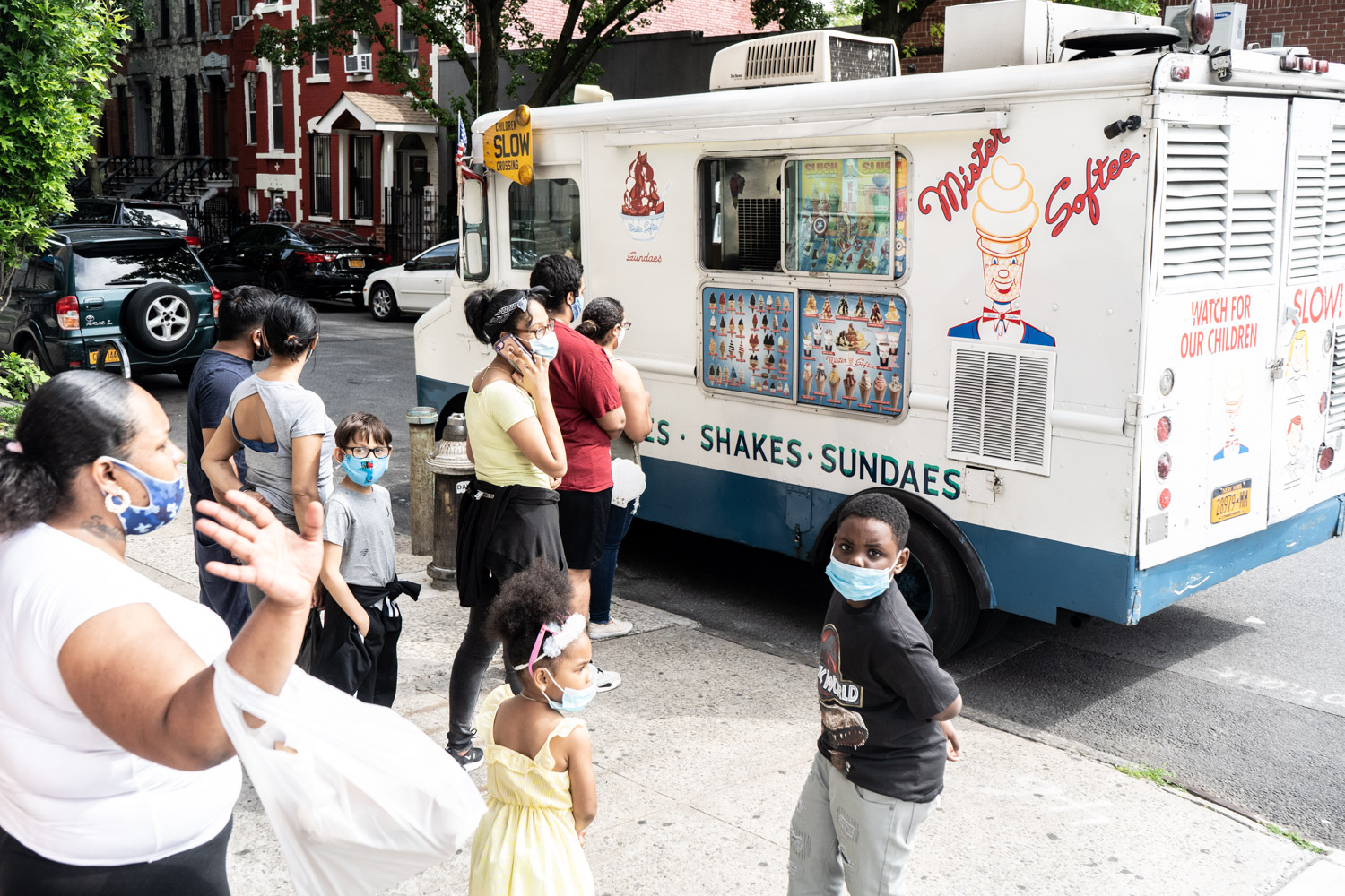 May 27, 2020: Lining up for ice cream at East 140th Street and Willis Avenue, Bronx, New York. © Camilo José Vergara