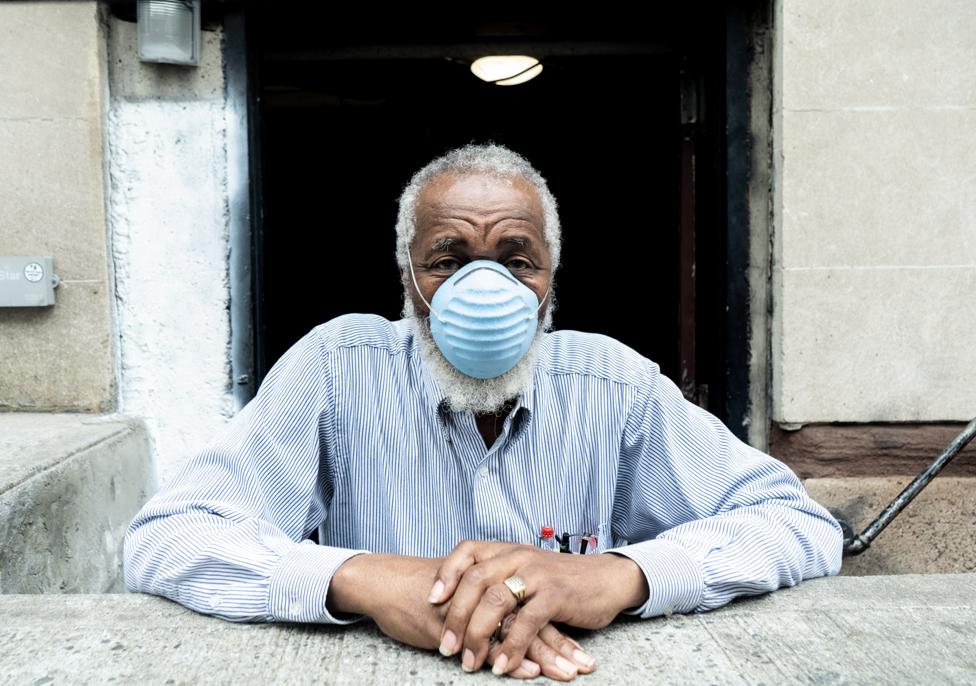May 28, 2020: Ronald, a 67-year-old building contractor, takes a break on Fulton Street at Arlington Place in Brooklyn, NY. When asked about the pandemic, he tells me, “Things are better, there is nothing to be afraid of.” © Camilo José Vergara