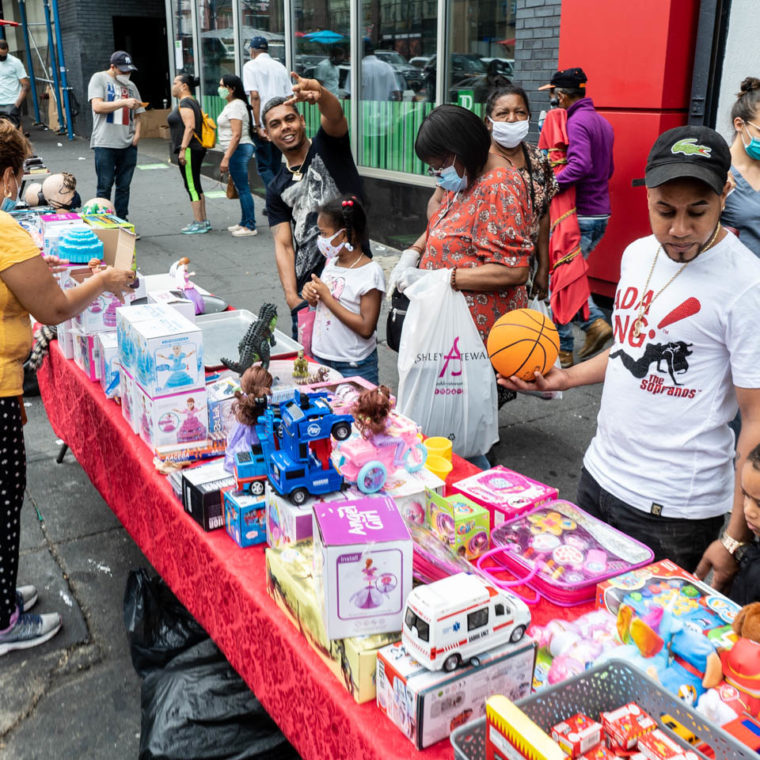 August 7, 2020: Street vendor selling toys. 383 East 149th Street, Bronx, New York. © Camilo José Vergara 