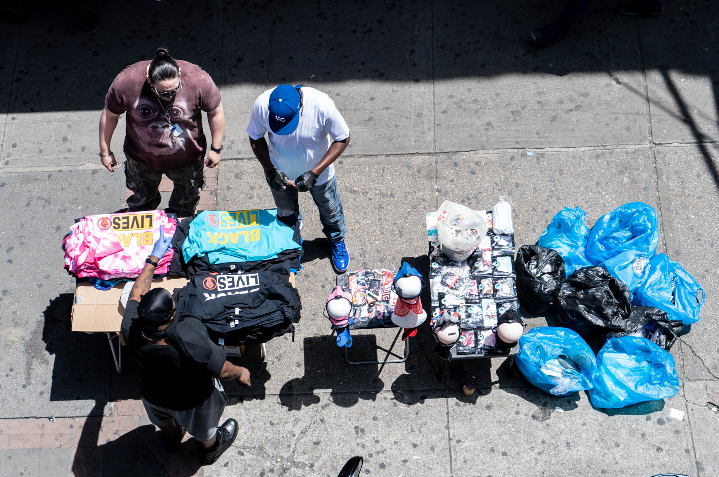 June 17, 2020: Black Lives Matter T-shirts and PPE for sale under the Simpson Street Subway Station. Westchester Avenue south of Southern Boulevard, Bronx, New York. © Camilo José Vergara