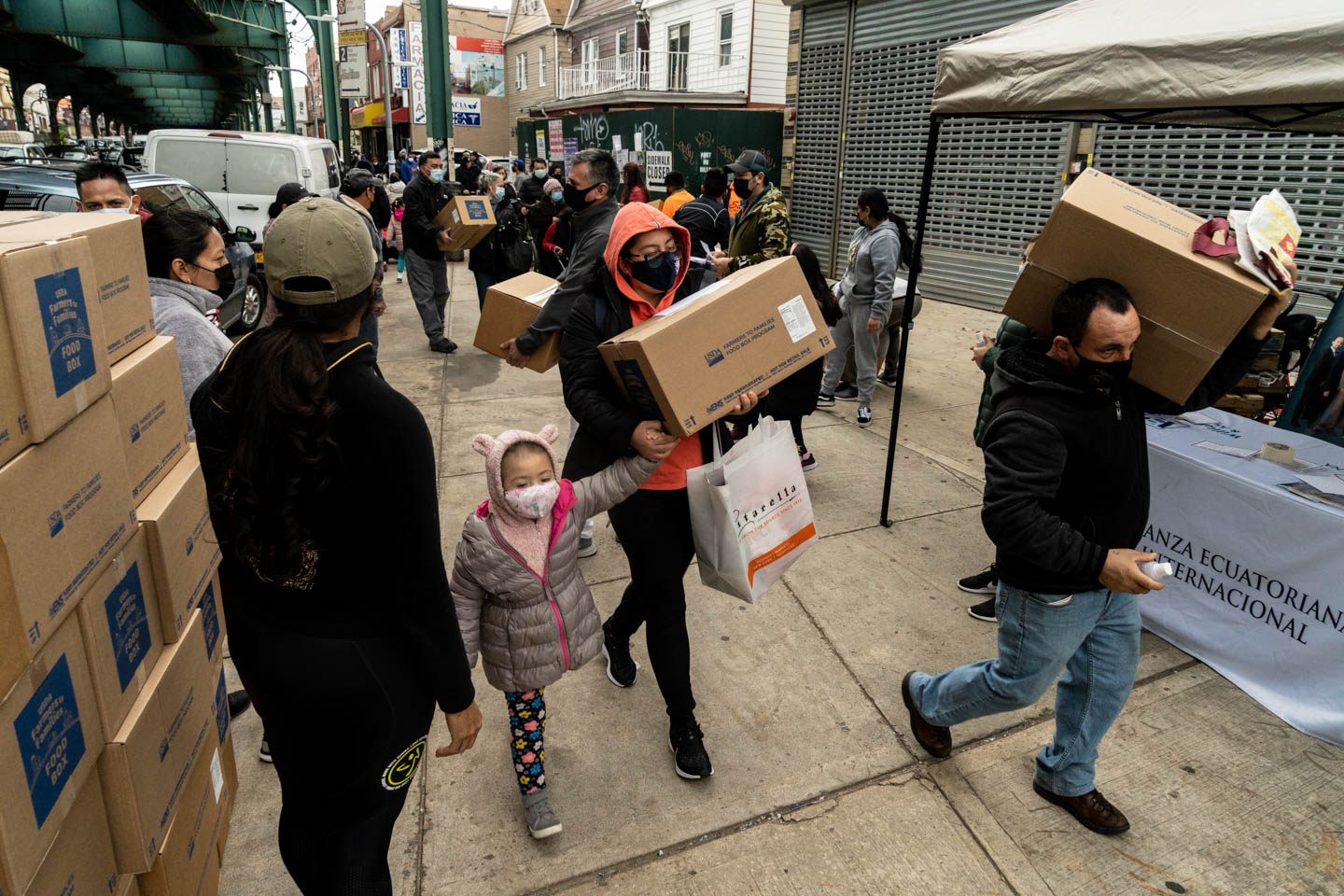 November 28, 2020: Boxes of food donated by the U. S. Department of Agriculture being distributed by the Centro Comunitario Andino. 104-10 Roosevelt Avenue, Queens, New York. © Camilo José Vergara