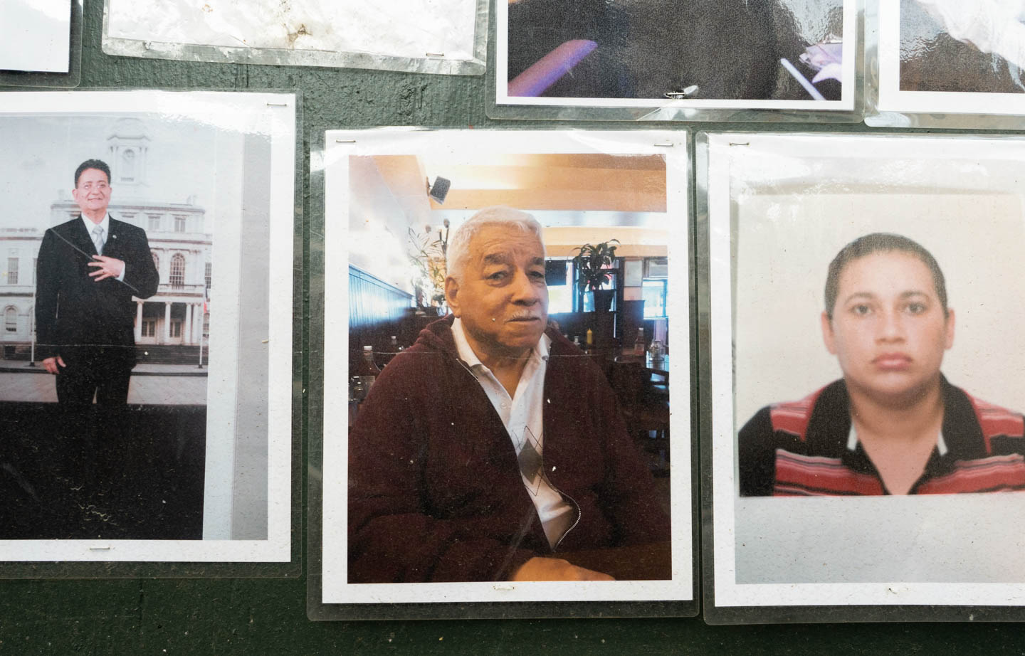 August 9, 2020: Rodrigo Caleno (left) and Carlos Ortiz (center), victims of the pandemic. “Memorial to Those Who Walked With Us,” by Make the Road New York, depicting young and old residents of Corona killed by Covid-19. 104-21 Roosevelt Avenue, Queens, New York. © Camilo José Vergara