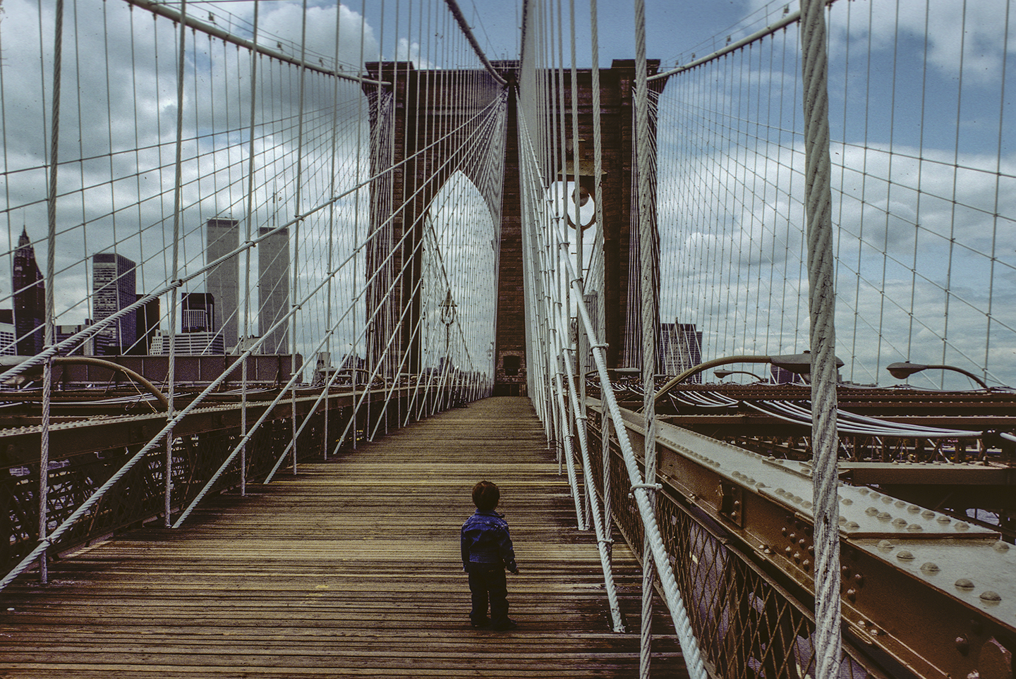View west from the Brooklyn Bridge with Charlie, Brooklyn, New York; 1983.